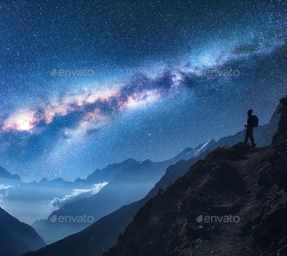 Space with Milky Way, girl and mountains at night - Stock Photo - Images