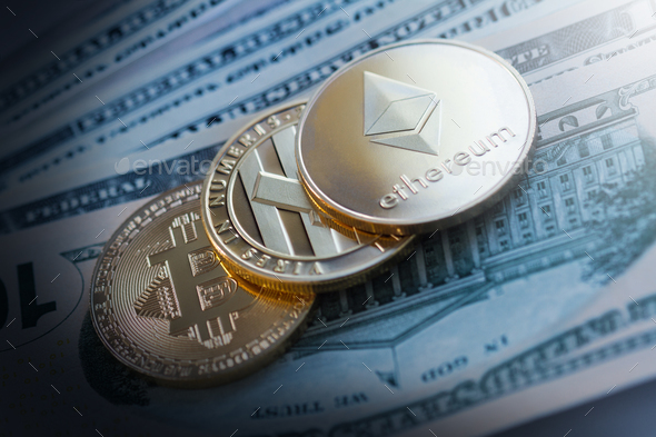 golden cryptocurrency coins on dollar bills - Stock Photo - Images