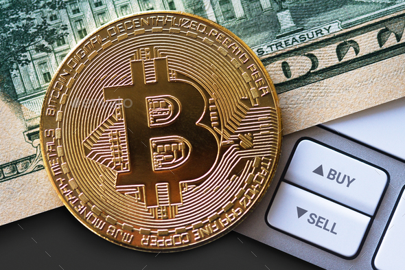 bitcoin coin on dollar bill with buttons - Stock Photo - Images