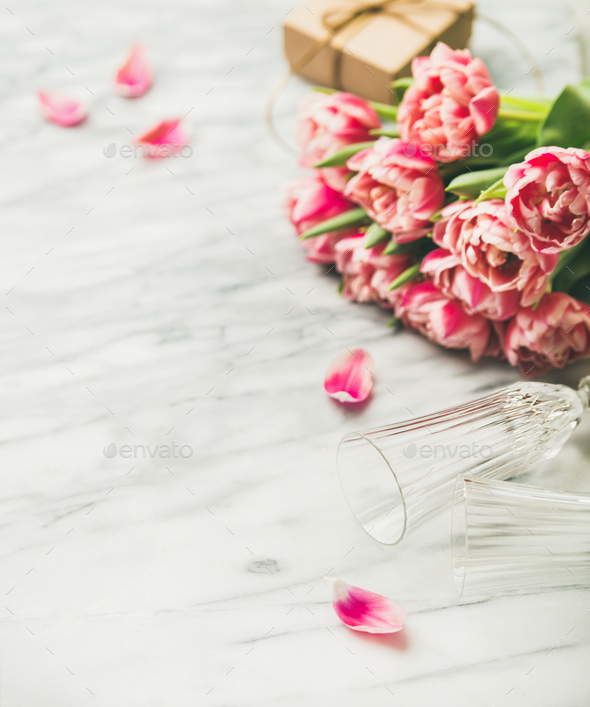 Pink tulips, champaign glasses and gift box with copy space - Stock Photo - Images