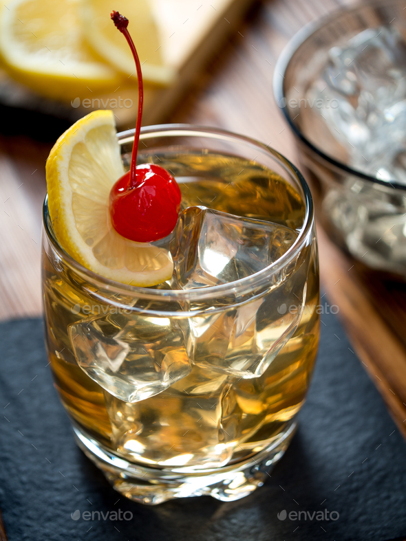 Glass of whiskey sour cocktail Stock Photo by alexbowmore | PhotoDune