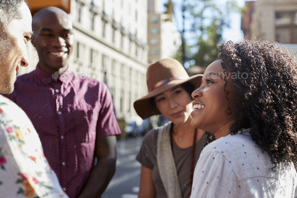 Group Of Friends Meeting On Urban Street In New York City Stock Photo by monkeybusiness