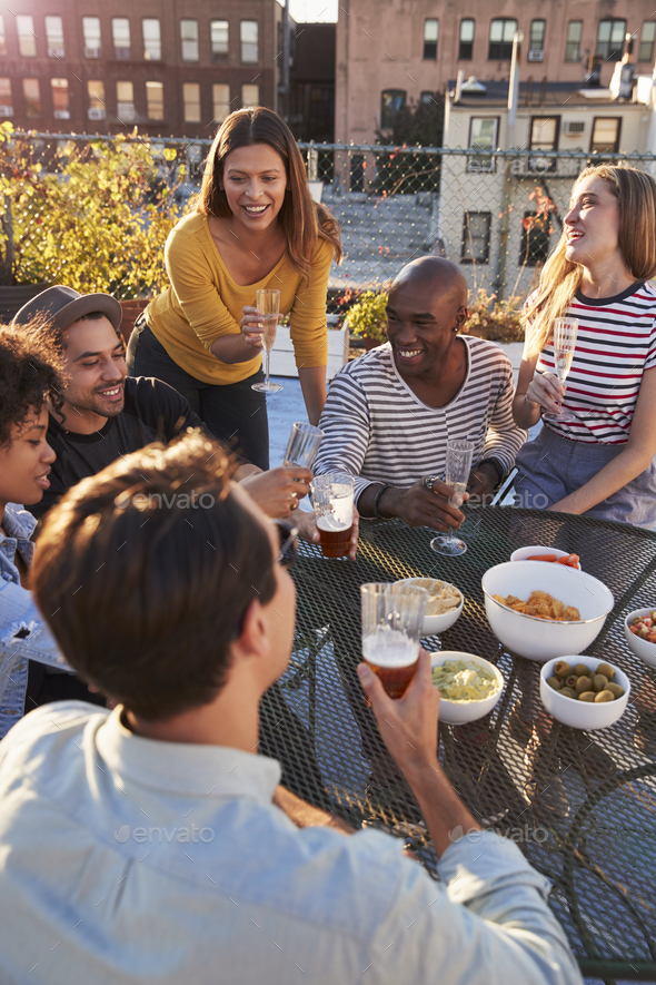 Friends Having A Party On A Rooftop Roof Terrace Vertical Stock Photo By Monkeybusiness