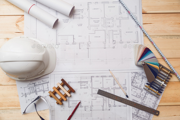 Architecture drawing desk, construction site working with blueprints in the office top view Stock Photo by Vladdeep