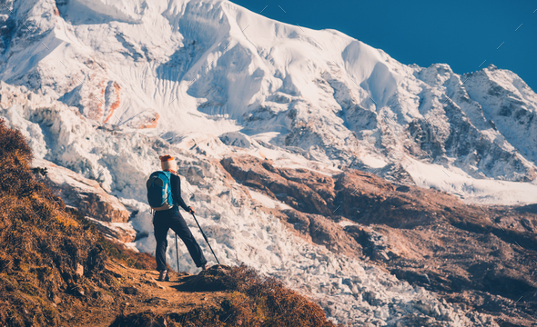 Woman on the hill and mazing mountains at sunset - Stock Photo - Images