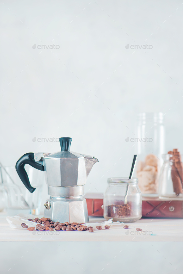 Creative barista concept. High key drink photography with Italian moka pot.  Still life with coffee Stock Photo by dinabelenko
