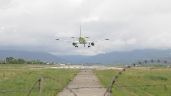 Airplane Landing To the Airport in Mountains - Georgia alt