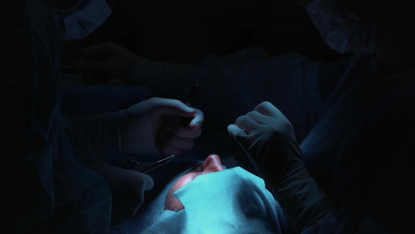 The Surgeon Is Performing an Operation on the Eyes, . Correction of Eyes and Eyes alt