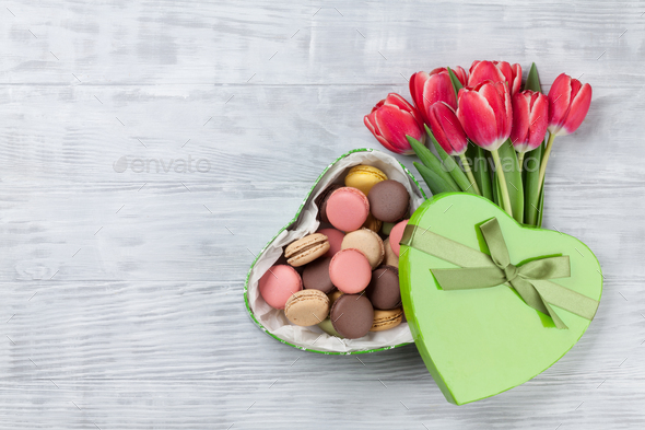 Red tulip flowers and macaroon cookies - Stock Photo - Images