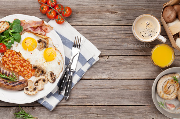 English breakfast. Fried eggs, sausages, bacon - Stock Photo - Images