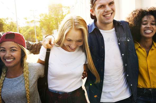Smiling happy young adult friends arms around shoulder walking o Stock Photo by Rawpixel