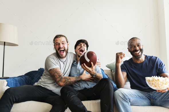 Friends cheering sport league together - Stock Photo - Images