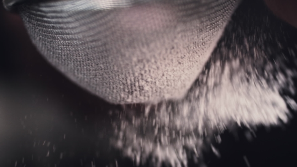 Hands of Cook Adding Powdered Sugar on the Peice Pie alt