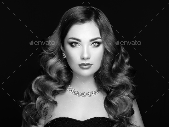 Brunette woman with long shiny wavy hair - Stock Photo - Images