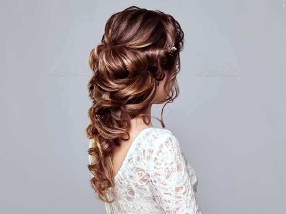 Brunette woman with long and shiny curly hair - Stock Photo - Images