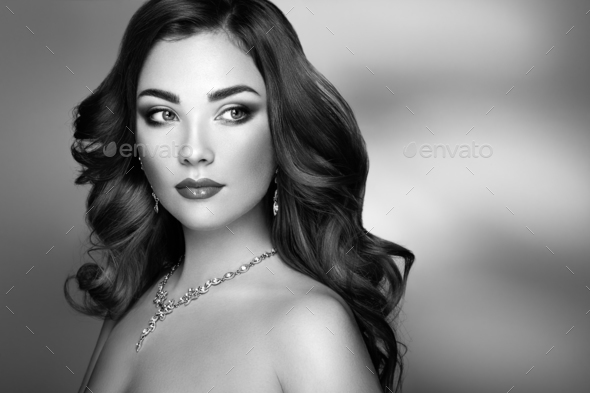 Brunette woman with long shiny wavy hair - Stock Photo - Images