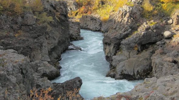 Rocky Ravines River with Flowing Glacier Meltwater in Western of Iceland in Autumn