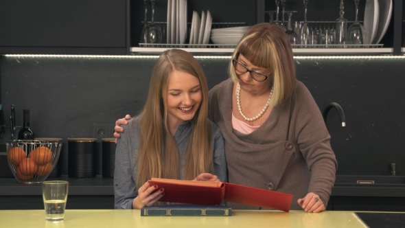 Mother and Daughter Looking Family Album alt