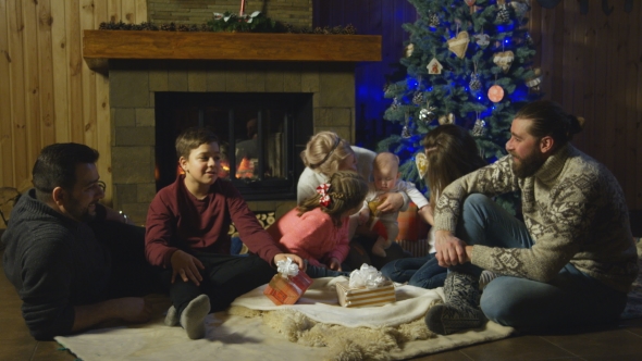 Content Family at Fireplace Before Christmas alt