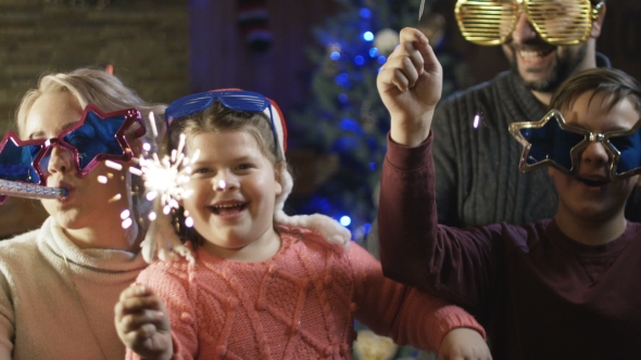Bright Excited Family with Sparkles Having Christmas alt