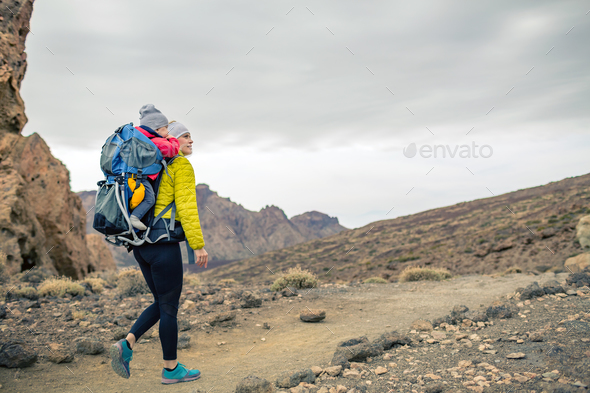 Super mom with baby boy hiking in backpack Stock Photo by blas | PhotoDune