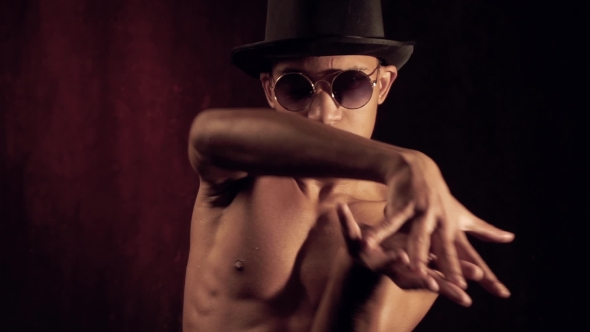Man in a Hat and Glasses Dances