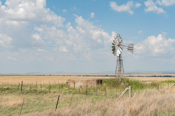 Farm scene with water-pumping windmill between Verkeerdevlei and Excelsior - Stock Photo - Images