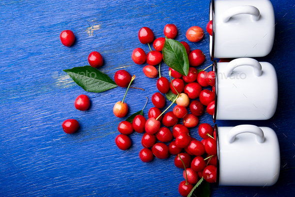 Red cherries in white basket - Stock Photo - Images