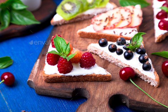 Fruit toast on wooden board - Stock Photo - Images