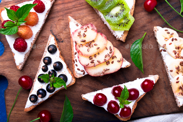 Fruit toast on wooden board - Stock Photo - Images