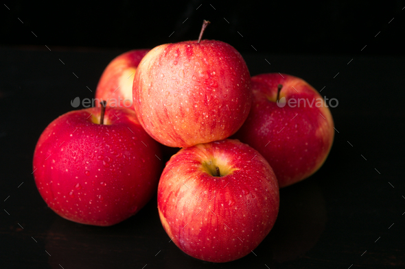 Red apples on black background Stock Photo by bondarillia | PhotoDune