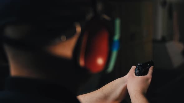 Police Shooter Trains to Shoot Against the Clock with an Instructor From a Pistol in a Special alt
