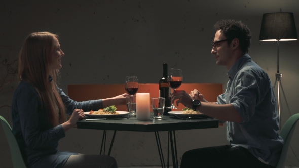 Young Couple Drinks Red Wine alt