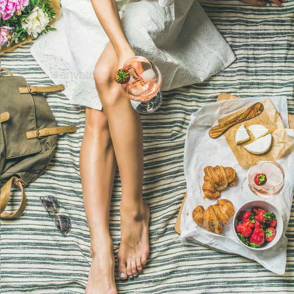Woman in dress sitting with wine and snacks, square crop - Stock Photo - Images