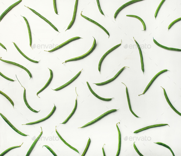 Flat-lay of fresh green beans over white wooden background - Stock Photo - Images