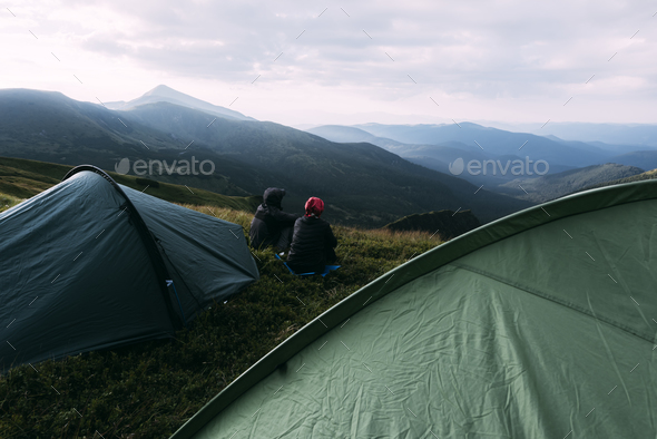 Couple near tent on mountains closeup - Stock Photo - Images