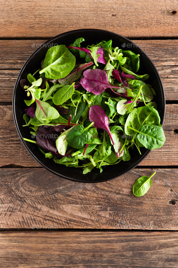 Fresh salad mix of baby spinach arugula leaves basil and chard. Italian cuisine