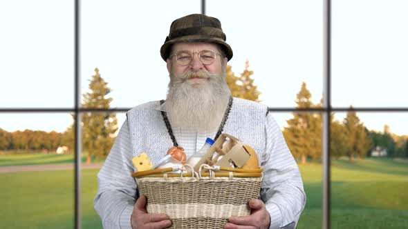 Portrait of Friendly Farmer Presenting Healthy Food. alt