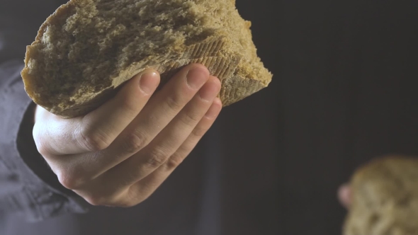 Baker Hands Breaking Homemade Bread