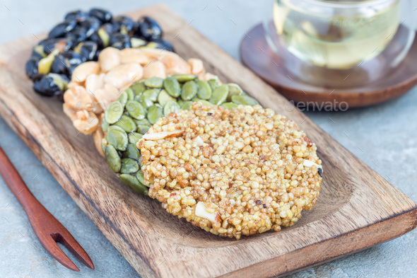 Korean traditional sweet snacks on a wooden plate, horizontal - Stock Photo - Images