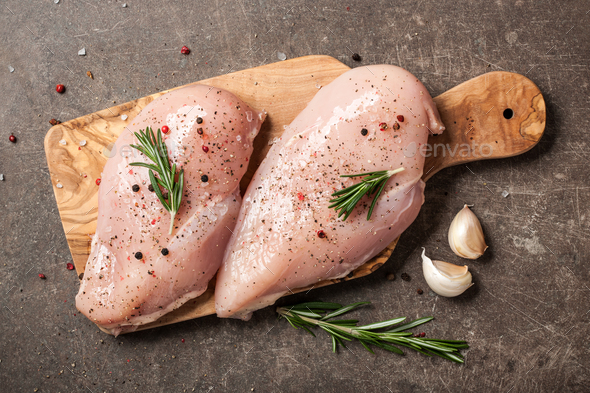 Fresh raw chicken on cutting board and spices for cooking Stock Photo by  ff-photo