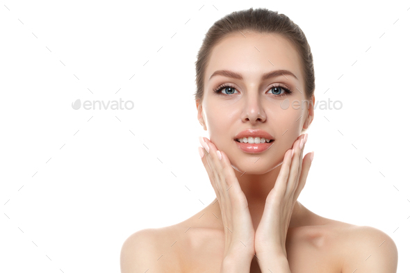 Portrait of young beautiful woman touching her face - Stock Photo - Images