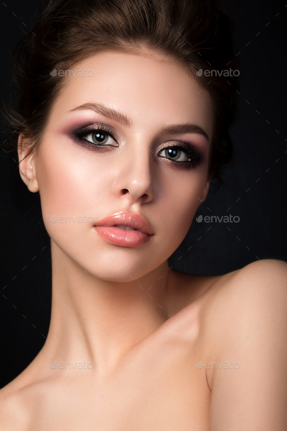 Portrait of young beautiful woman with evening make up - Stock Photo - Images