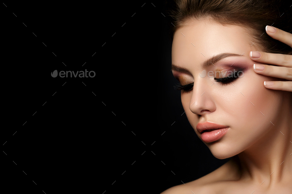 Portrait of young beautiful woman with evening make up - Stock Photo - Images
