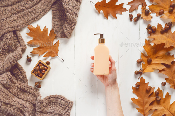 Liquid soap bottle in female hands - Stock Photo - Images