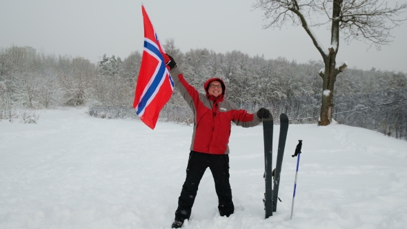 Happy Man Sport Fan Waving Flag of Norway Outdoors