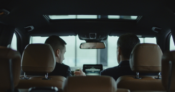 Customer and Dealer in Car alt