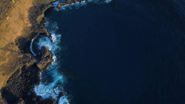 Top Down View of Waves and Clifs