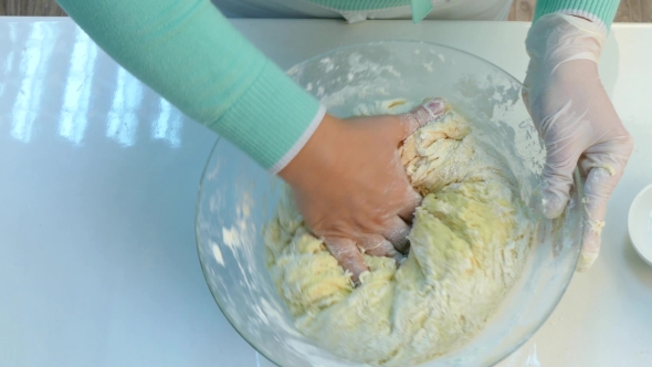 The Cook Kneads Raw Dough.