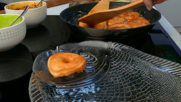 the Cook Pulls the Donuts Out of the Frying Pan